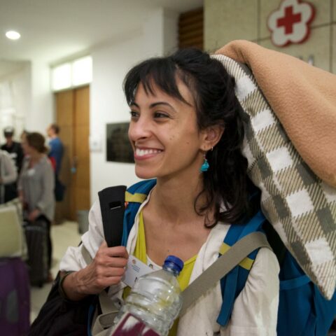 A humanitarian with a large backpack while traveling